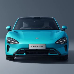 Front view of a turquoise Xiaomi SU7 car.