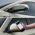 Two images showing a car's side mirror with LED lights and a hand holding a smartphone interacting with the car.