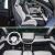 Two images showing the interior of a Volkswagen car, including seats and a dashboard with a large screen.