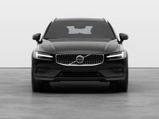 Front view of a black Volvo SUV, featuring its signature Thor's hammer LED headlights and distinctive grille emblem in a clean studio setting.