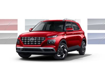 Three-quarter view of the front side of a red 2026 Hyundai Venue