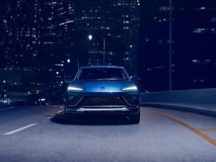 Sleek blue electric SUV: bold design, dynamic performance, and futuristic style for urban night drives.
