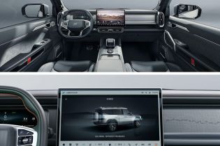 Interior of a car, featuring a large central screen and modern dashboard design.