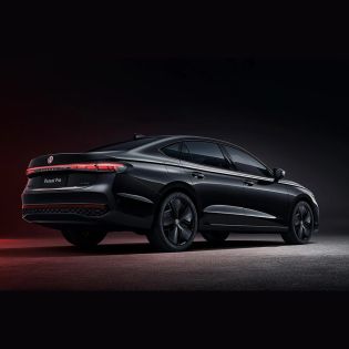 Rear side view of a black Volkswagen Passat Pro sedan.