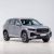 Front side view of a silver Geely SUV.