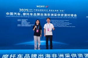 Two people posing at the Supply and Purchase Matchmaking Event of Chinese Automotive and Motorcycle Brands into the African Market.