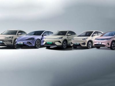 A lineup of five BYD electric cars in different colors.