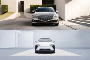 Split front-view comparison image of two Genesis luxury sedans; upper silver model with intricate mesh grille, lower white variant featuring minimalist smooth front fascia design