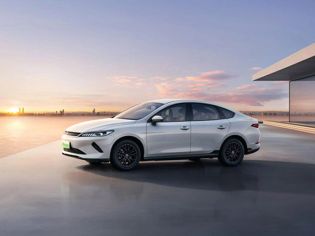BYD electric sedan: Sleek white design, eco-friendly performance, and modern style for coastal drives.