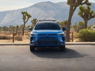 Bold blue Toyota SUV: rugged design, reliable performance, and adventure-ready for desert landscapes.