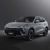 A silver T5 HEV SUV with black accents, showcased against a dark background, highlighting its modern design, illuminated headlights, and sleek black alloy wheels.