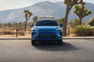 Bold blue Toyota SUV: rugged design, reliable performance, and adventure-ready for desert landscapes.