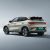Side and rear view of a light-colored BYD Yuan Plus electric SUV.