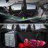 Interior and trunk of a car, with fresh air in the cabin and items like a suitcase, skateboard, and boxing gloves in the trunk.