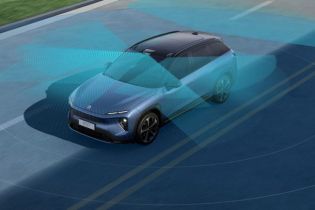 Blue electric SUV with a semi-transparent blue sensor field, showcasing advanced driver-assistance systems on the road.