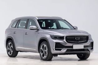 Front side view of a silver Geely SUV.