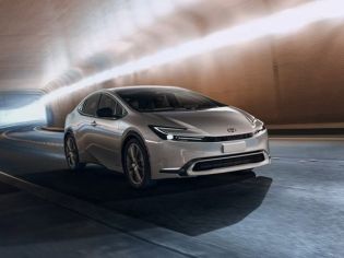2026 Toyota Prius Limited Edition AWD model, front three-quarter view at high speed