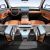 A look at the interior of a car, showcasing a sleek dashboard with a large screen, comfortable seats, and a spacious rear area.