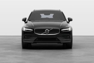 Front view of a black Volvo SUV, featuring its signature Thor's hammer LED headlights and distinctive grille emblem in a clean studio setting.