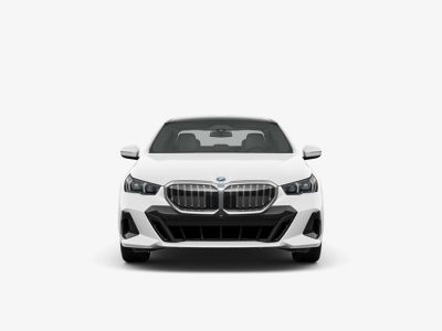 Head-on studio shot of new white BMW luxury car on plain background