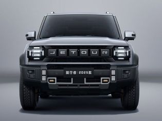 The 2025 Jetour Traveler SUV, in a sleek gray finish, features a bold front design with prominent "JETOUR" branding and rugged off-road elements, showcased against a minimalist gray backdrop.