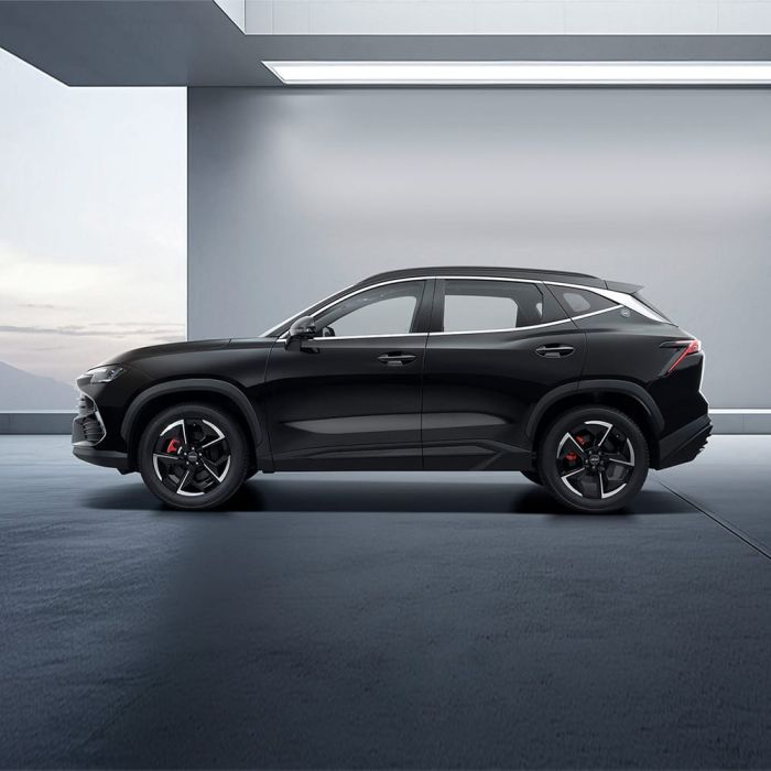 A black Jetour Dsashing in a modern, minimalist indoor space.