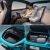 Interior and trunk details of Xiaomi SU7, with a person using a laptop in the car.