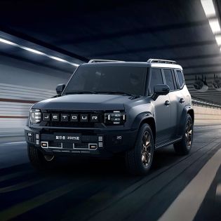 Jetour off - road vehicle driving in a tunnel.