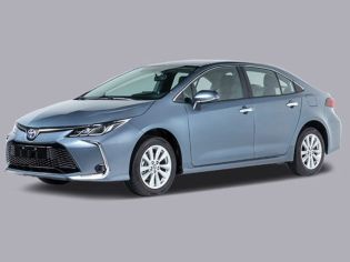 Full view of a 2025 Toyota Corolla, showing the front grille, headlights, and wheels.