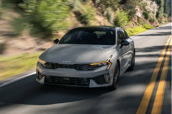 A 2026 Kia K5 speeding along