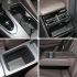 Four views of car interior storage spaces, including cup holders and compartments.