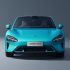 Front view of a turquoise Xiaomi SU7 car.