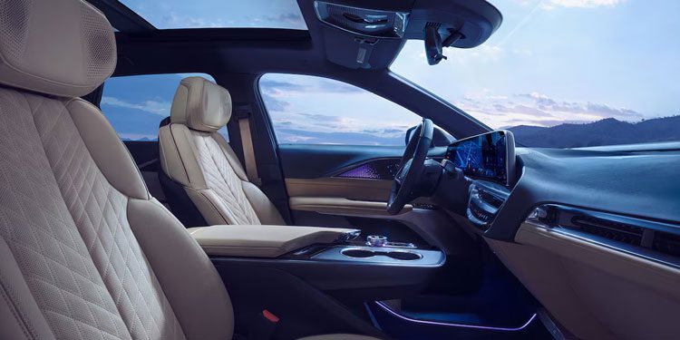 Passenger Seat View of the 2025 Cadillac LYRIQ Front Row Cabin Overlooking the Mountains