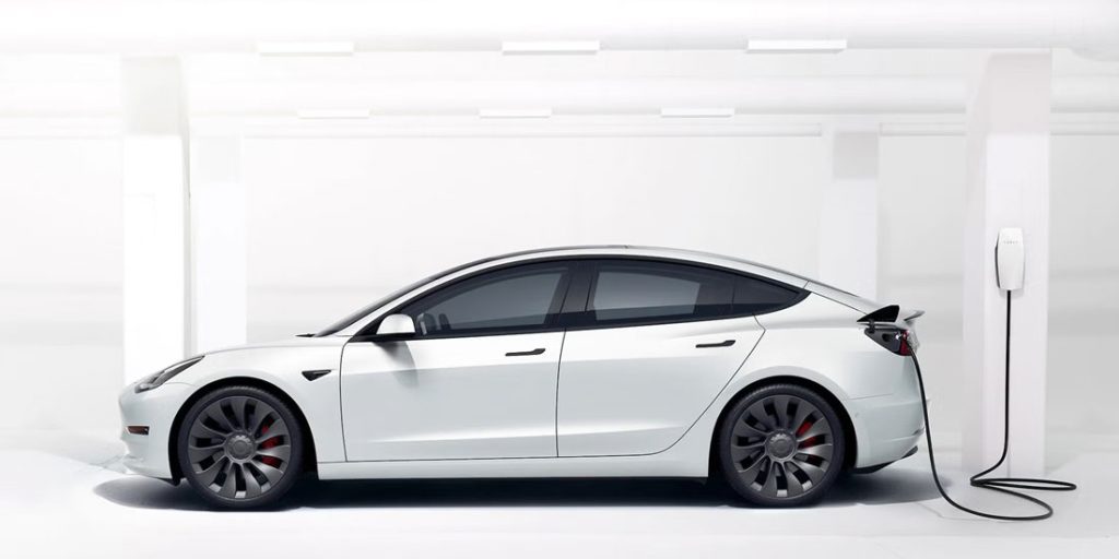 2022 tesla model 3 side view charging