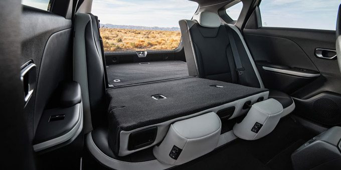 2026 Kia K4 Hatchback with the rear seats folded down for extended cargo space, full-view