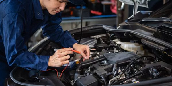 Automotive inspectors inspect engines