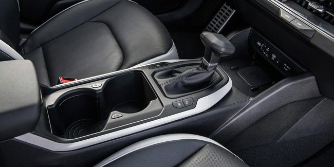 Close-up of the 2026 Kia K4 Hatchback's center console, and gear stick