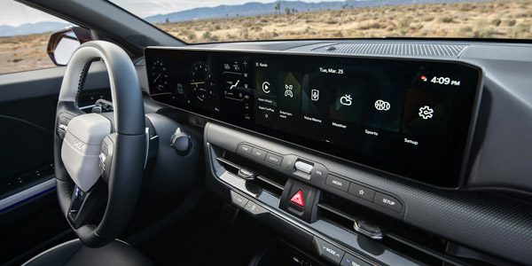 Close-up of the 2026 Kia K4 Hatchback's digital display and steering wheel