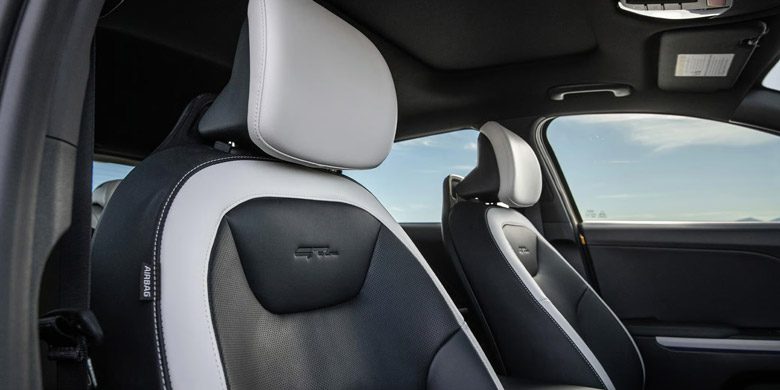 Close-up of the 2026 Kia K4 Hatchback's front-row seats with the GT-Line patch stitched onto the seat