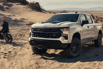 2026 Chevrolet Silverado LD Trail Boss parked on a sandy environment