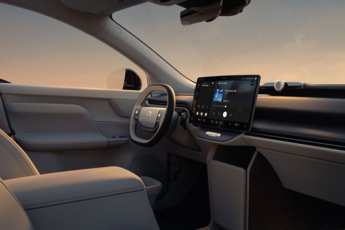 The interior of the 2026 Volvo EX60 showing the steering wheel, center display and front seats