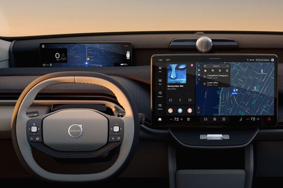 The dashboard of the 2026 Volvo EX60 showing the steering wheel, driver display and center display