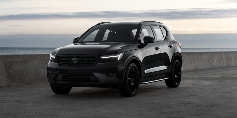 Front angle of 2026 Volvo XC40 Black Edition in front of water
