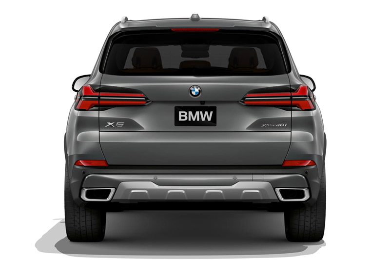 BMW X5 rear view: Sleek gray SUV with distinctive L-shaped LED taillights, dual chrome exhaust tips, and xDrive40i badging.