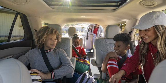 A family loading into a 2026 Ford Explorer SUV