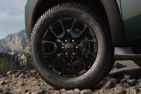 2026 Nissan Armada NISMO detail of 20-inch aluminum-alloy wheel with all-terrain tire