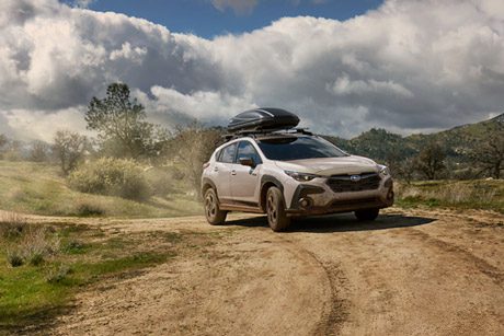 2026 Subaru Crosstrek Limited Hybrid shown in Sand Dune Pearl with accessory equipment