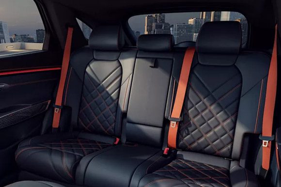 Front-to-backseat view of 2026 Genesis GV70 interior in Obsidian Black & Ultra-Marine Blue