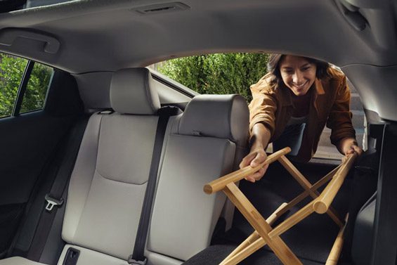 2026 Toyota Prius Limited Edition AWD model with rear seats folded down provides ample space