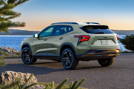 Driver's Side profile View of a 2026 Chevy Trax Parked Facing a Lake